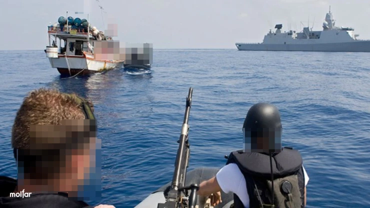 People with guns near boats