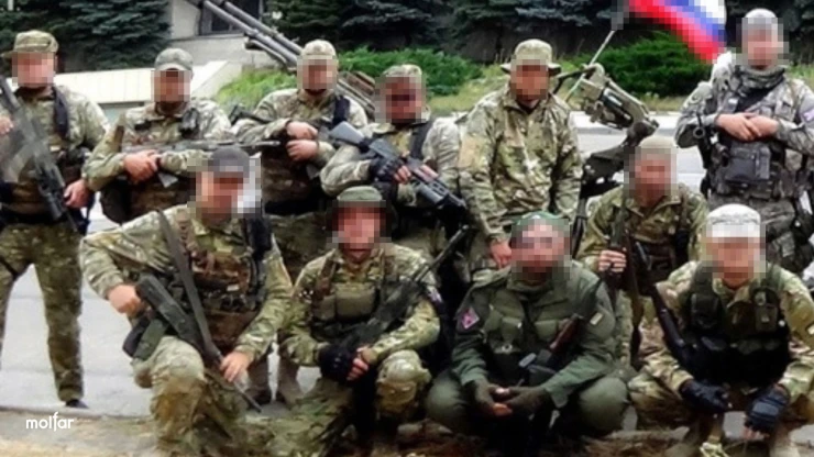 Group of armed men in camouflage