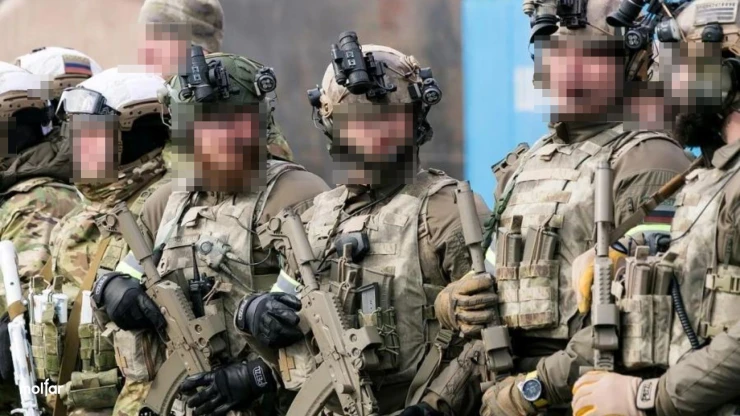 Group of armed men in camouflage