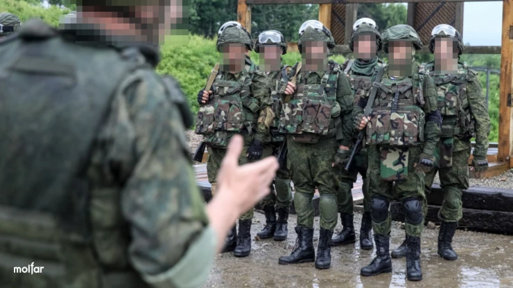 Group of armed men in military uniform