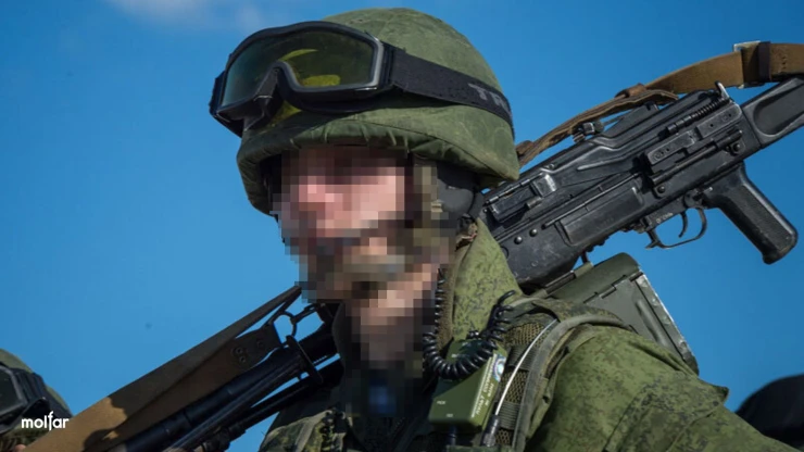 A soldier in a Russian uniform with a weapon on his shoulder