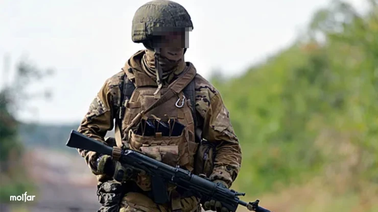 Armed man in camouflage